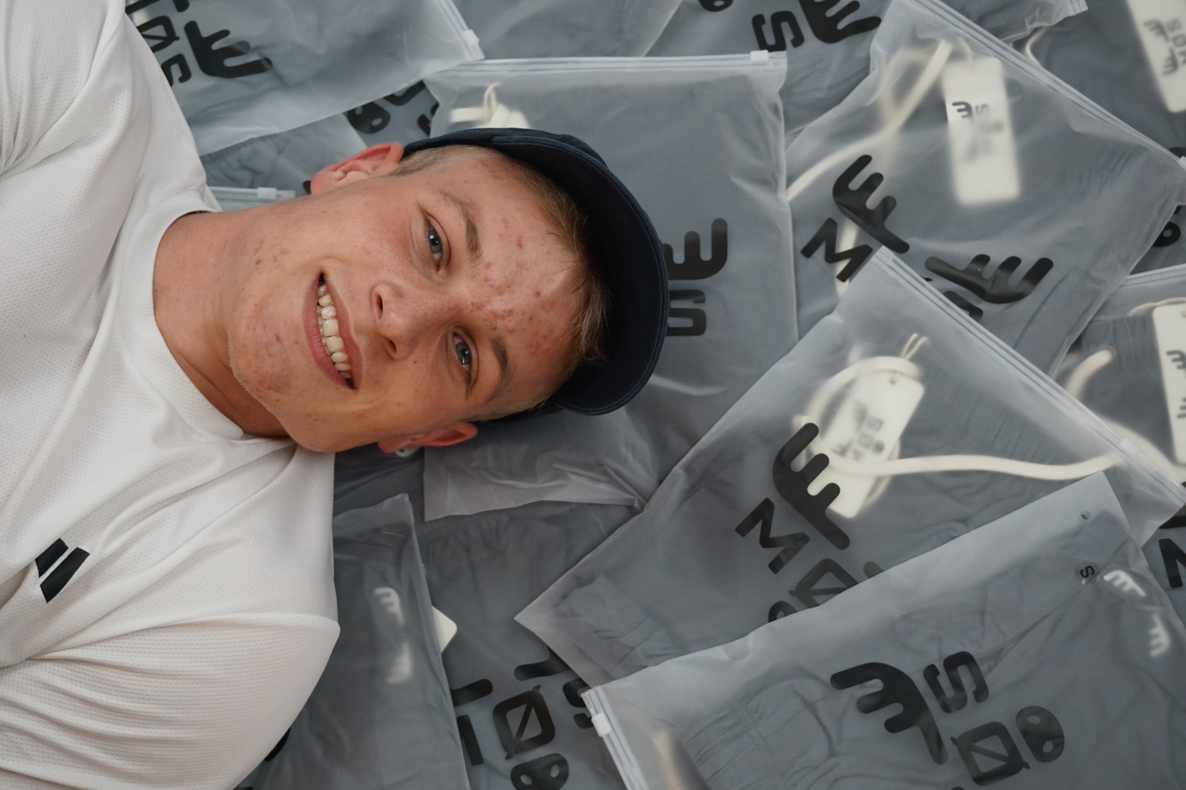 MØS founder surrounded by the first run of packaging